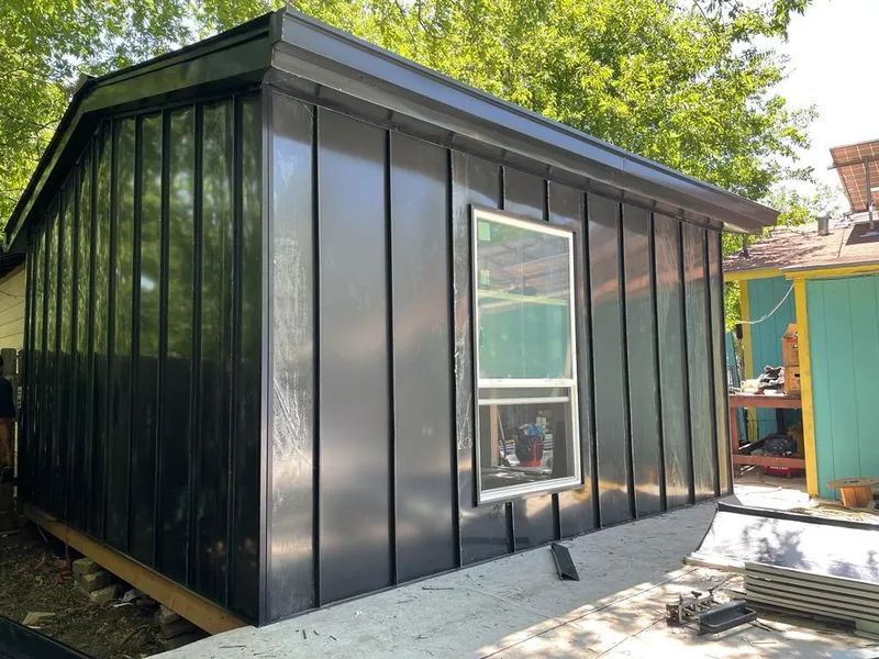 Black standing seam metal wall panels for Metal Roof Installation in Jacksonville