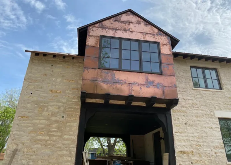 Copper metal panel facade on a stone building for Metal Roof Coating in Jacksonville